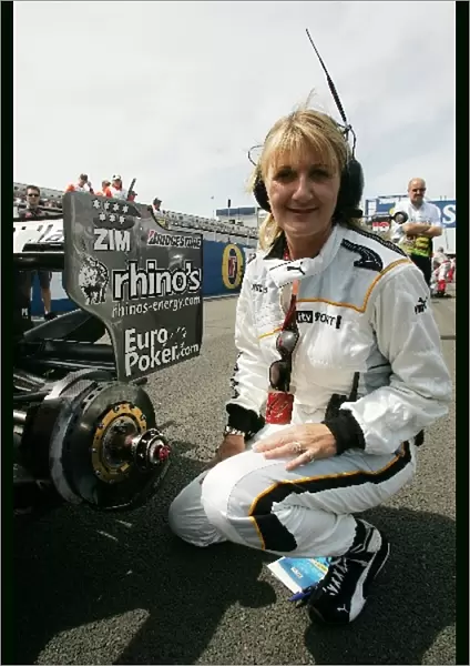 Formula One World Championship: Louise Goodman ITV Pit Lane Reporter joins the Midland pit crew on wheel change duties during the British GP