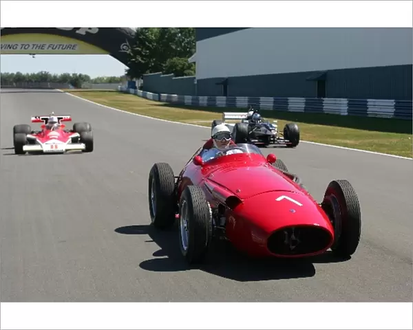 GP Live Launch: Sir Stirling Moss Maserati 250F flanked by a McLaren M23 Cosworth and Paul Stoddart Minardi F1x2 two seater