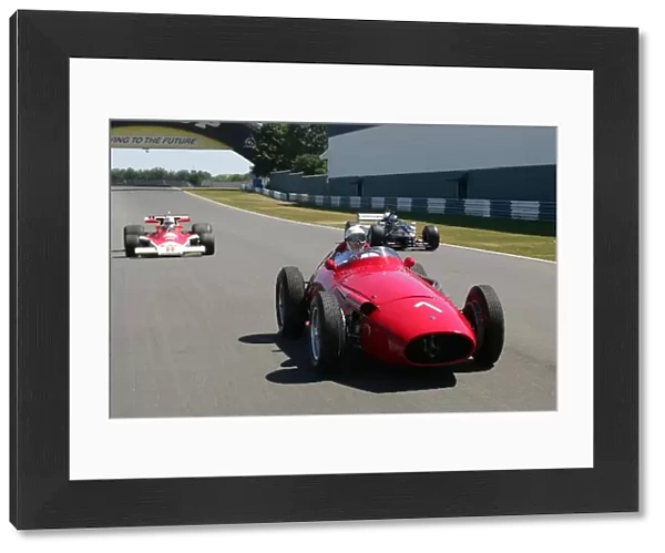 GP Live Launch: Sir Stirling Moss Maserati 250F flanked by a McLaren M23 Cosworth and Paul Stoddart Minardi F1x2 two seater