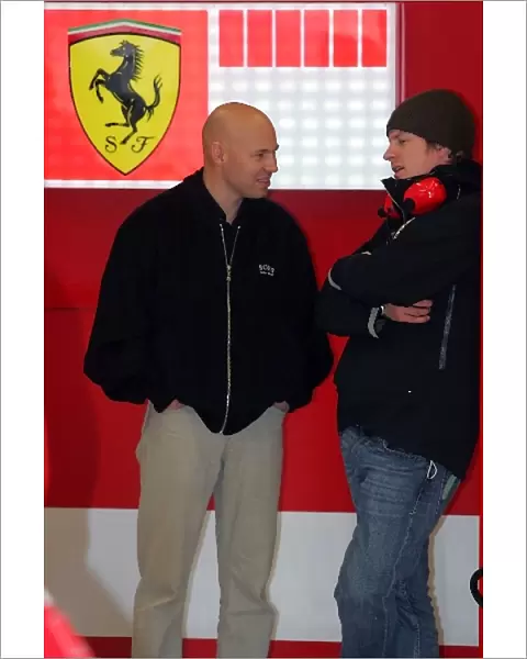 Formula One Testing: Kimi Raikkonen Ferrari in the Ferrari garage with his trainer Mark Arnell