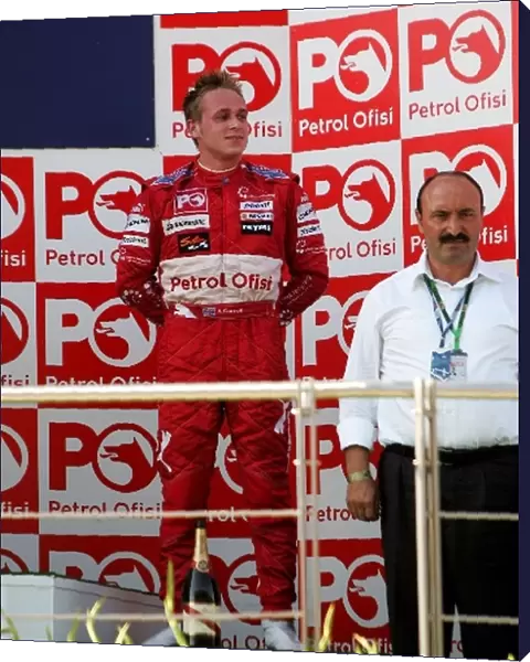 GP2 Series: Third placed Adam Carroll FMS International on the podium