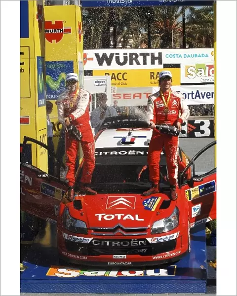 2007 FIA World Rally Championship: L-R: Daniel Elena and Sebastien Loeb spray the winners champagne on the podium