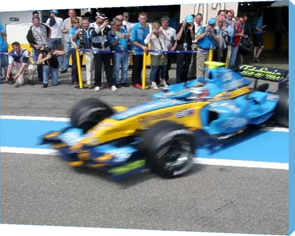 Formula One Testing: Renault fans watch Heikki Kovalainen Renault R26 exit the pit lane
