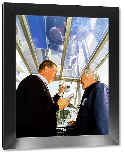 2001 European Grand Prix. Nurburgring, Germany. 22nd - 24th June 2001. Alan Henry talks to Charlie Whiting, FIA Race Director, on the start line gantry, portrait. World Copyright: LAT Photographic