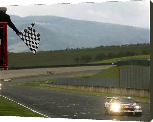FIA GT Championship: Race winner Karl Wendlinger Race Alliance Aston Martin DBR9, crosses the line