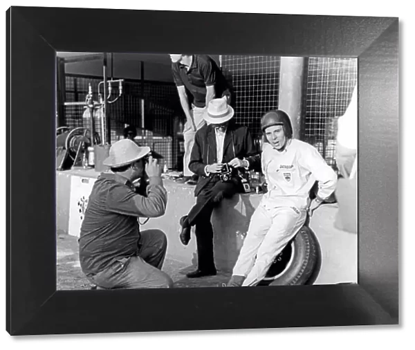 Jabby Crombac in the pit lane with Jim Clark. Portrait. World Copyright: LAT Photographic ref: 35mm Transparency