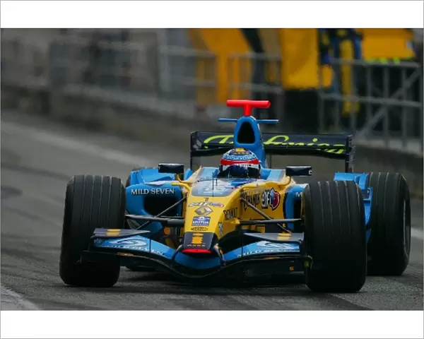 Formula One Testing: Fernando Alonso Renault R26 gets sideways in the pitlane