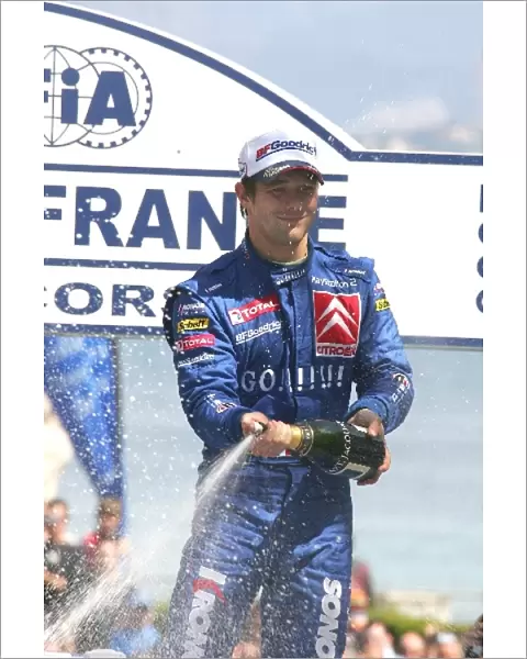 FIA World Rally Championship: Rally winner Sebastien Loeb sprays champagne on the podium