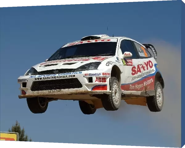 FIA World Rally Championship: Gareth MacHale, Ford Focus RS WRC, flies high at the jump on Stage 11