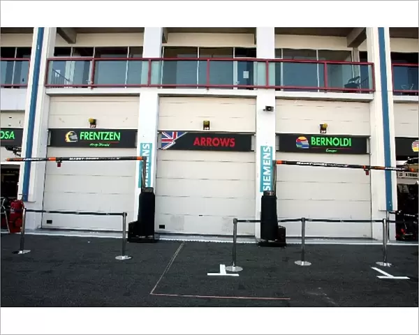 Formula One World Championship: Saturday afternoon and the Arrows garage doors are closed and the team are leaving