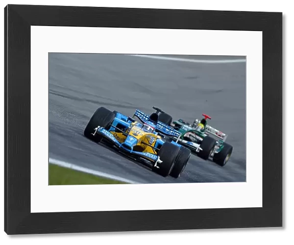 Formula One World Championship: Race retiree Fernando Alonso Renault R23 leads Mark Webber Jaguar Cosworth R4 behind the safety car