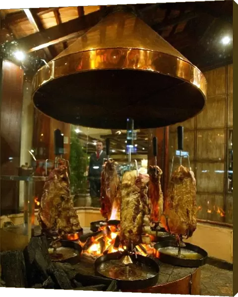 Formula One World Championship: Roasting meat at the Foga da Chao restaurant in Sao Paulo, a favourite with F1 folk