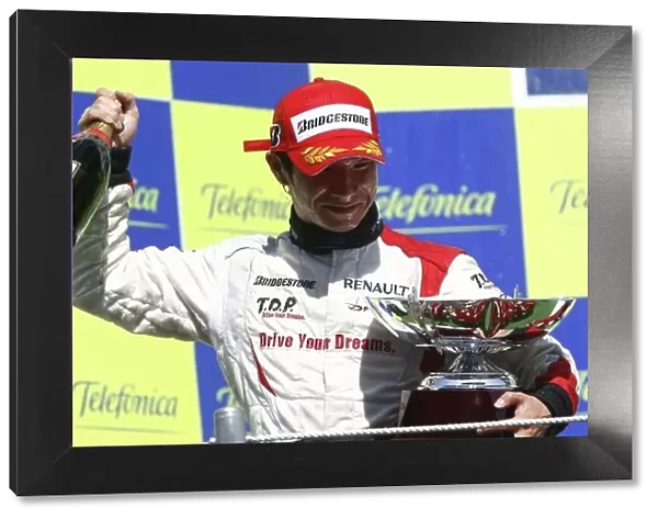 2008 GP2 Series. Round 1. Sunday Race. Barcelona, Spain. 27th April 2008 Kamui Kobayashi (JPN, Dams) celebrates victory on the podium. World Copyright: Andrew Ferraro / GP2 Series Media Service. ref:__H0Y2537. jpg