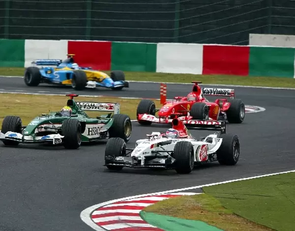 Formula One World Championship: Sixth placed Takuma Sato BAR Honda 005 battles with Mark Webber Jaguar Cosworth R4