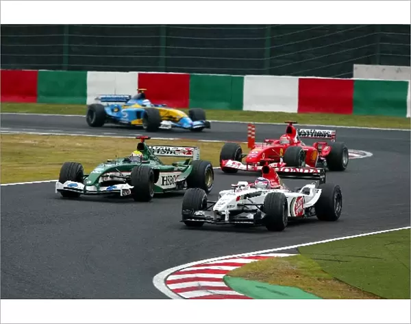 Formula One World Championship: Sixth placed Takuma Sato BAR Honda 005 battles with Mark Webber Jaguar Cosworth R4