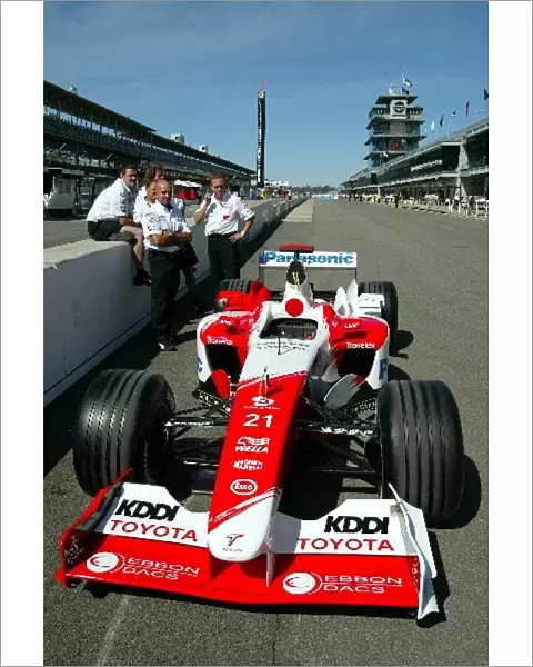 Formula One World Championship: Mechanics and a Toyota TF103 in the Indianapolis pitlane