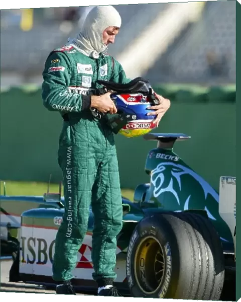 Formula One Testing: Mark Webber inspects his Jaguar Cosworth R4