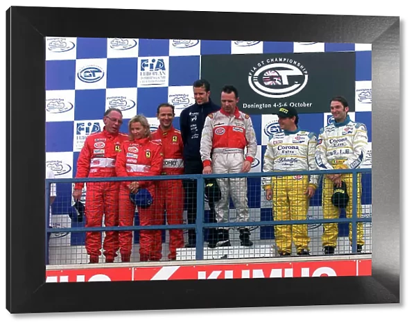 2002 FIA GT Championship Donington Park, England. 5th - 6th October 2002. Race podiumMike Hezemans / Anthony Kumpen (Chrysler Viper GTS-R) 1st, Enzo Calderari / Lilian Bryner / Jean Marc Gounon (Ferrari 550 Maranello)