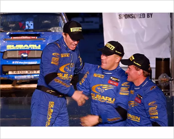 World Rally Championship: Subaru team mates Petter Solberg, Kaj Lindstrom and Tommi Makinen celebrate on the podium