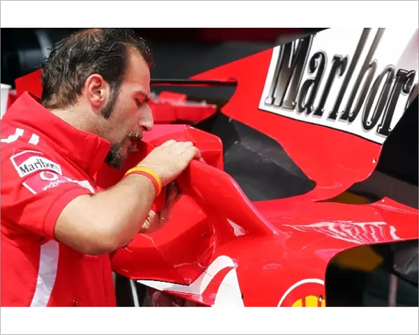 Formula One World Championship: Ferrari mechanic adds winglets to the Ferrari F2005