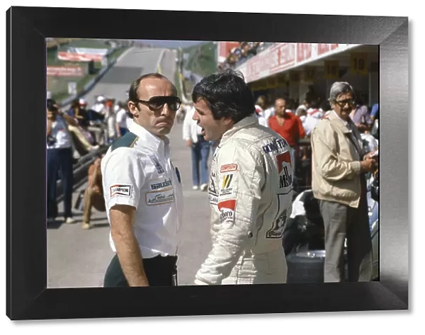 1980 Austrian Grand Prix. Osterreichring, Austrian. 15-17 August 1980. Williams team boss Frank Williams talks with his driver Alan Jones. Ref-80 AUT 12. World Copyright - LAT Photographic