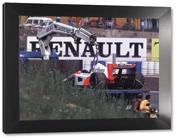 Ayrton Sennas car is recovered Spanish Grand Prix, Barcelona 1991 World LAT Photographic Somerset House, Somerset Road, Teddington, Middlesex. Tel: +44 (0) 181 251 3000 Fax: +44 (0) 181 251 3001