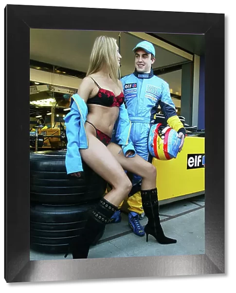2003 Australian Grand Prix, Albert Park, Melbourne, Australia. 6th March 2003. Fernando Alonso, Renault R23, with the Wonder Bra model Marina Dior. World Copyright LAT Photographic Digital image only