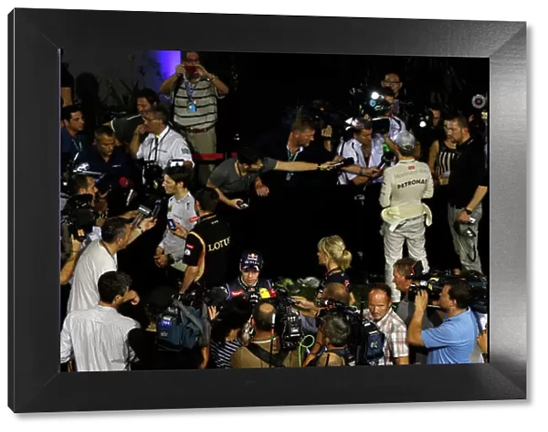 Marina Bay Circuit, Singapore. Saturday 21st September 2013. Nico Rosberg, Mercedes AMG, Sebastian Vettel, Red Bull Racing, and Romain Grosjean, Lotus F1, talk to the media after qualifying