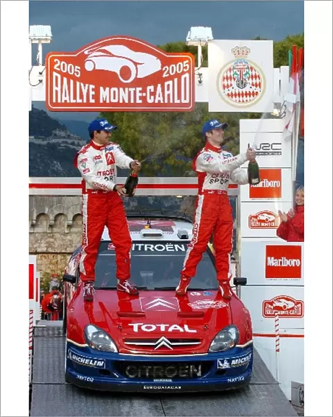 FIA World Rally Championship: Rally winners Sebastien Loeb with co-driver Daniel Elena Citroen Xsara WRC celebrates on the podium
