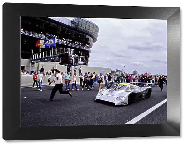 1991 Le Mans 24 hours. Le Mans, France. 22nd - 23rd June 1991. Karl Wendlinger  /  Michael Schumacher  /  Fritz Kreutzpointner (Mercedes-Benz C11), 5th position, crosses the finish line, action. World Copyright: LAT Photographic. Ref: 91LM n