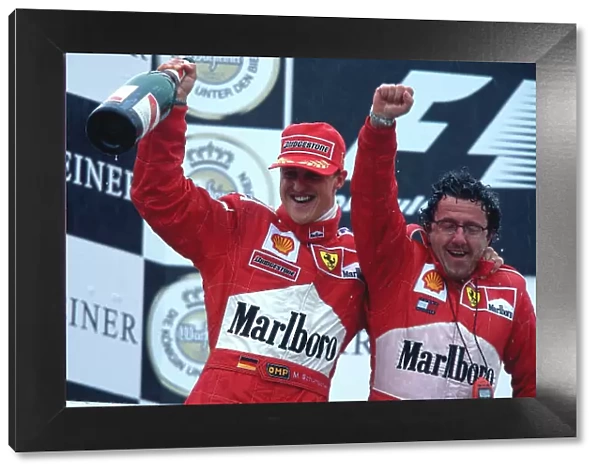 2000 European Grand Prix. Nurburgring, Germany. 19-21 May 2000. Michael Schumacher (Ferrari) celebrates his 1st position on the podium. Ref-2K EURO 66. World Copyright - LAT Photographic