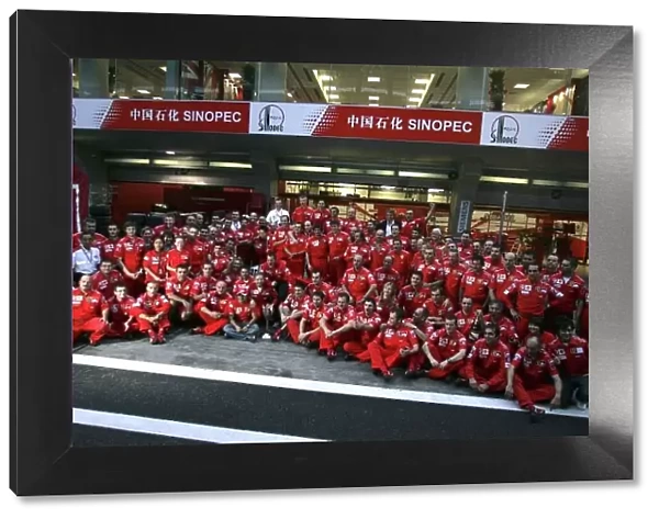 2006 Chinese Grand Prix - Sunday Race Shanghai International Circuit, Shanghai, China. 28th September - 1st October 2006. Michael Schumacher, Ferrari 248F1, 1st position, celebrates his 91st win with the whole team, in a group photo