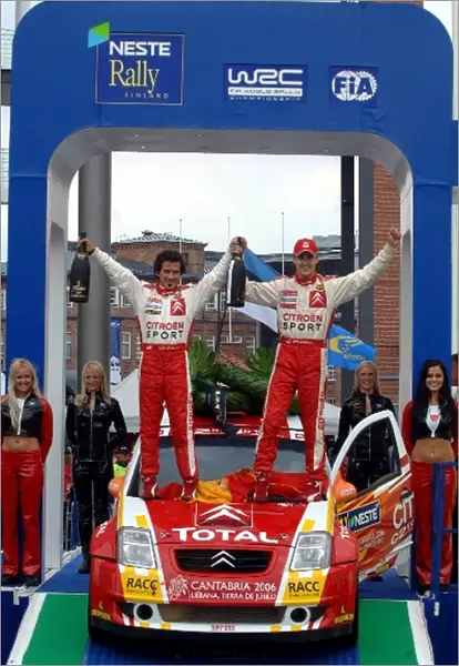 FIA World Rally Championship: Daniel Sordo and Marc Marti, Citroen C2 Super 1600, celebrate their win on the podium