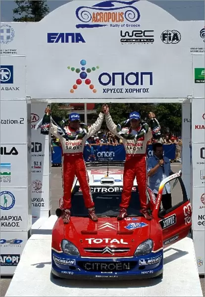 FIA World Rally Championship: R-L: Sebastien Loeb and Daniel Elena, Citroen, celebrate victory on the podium