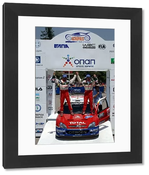 FIA World Rally Championship: R-L: Sebastien Loeb and Daniel Elena, Citroen, celebrate victory on the podium