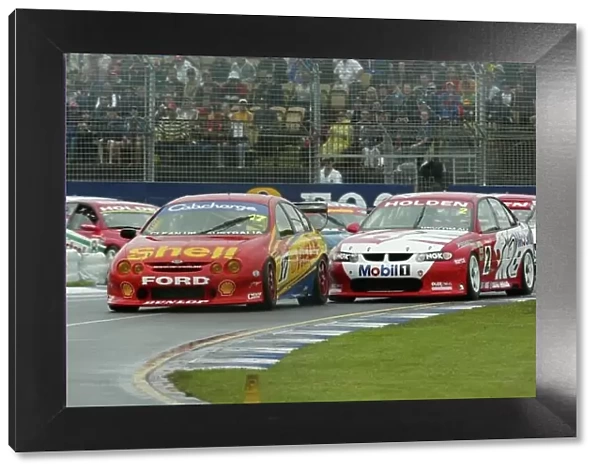V8 Supercar 2002 AGP : Holden driver Jason Bright and Ford driver Steve Johnson fight for the lead on the opening lap of race 2 at the 2002 Fosters Australian GP Bright went on to win race 2