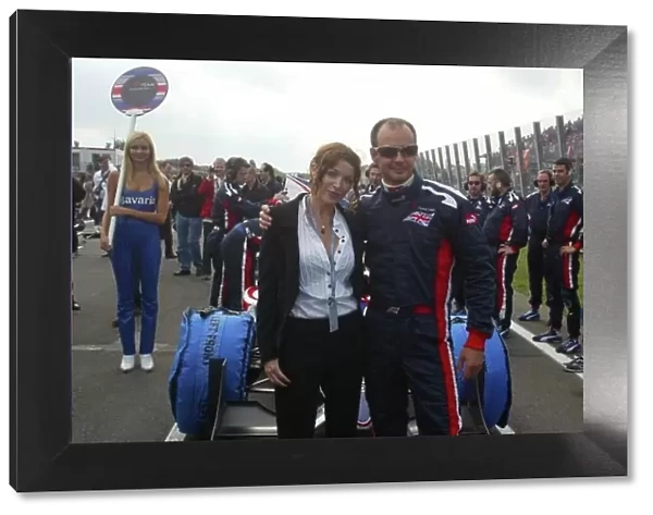 A1GP. Dannii Minogue (AUS) and Darren Manning (GBR) A1 Team Great Britain on the grid.