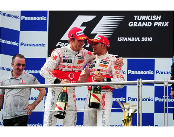 Formula One World Championship: The podium: second placed Jenson Button McLaren with race winner Lewis Hamilton McLaren
