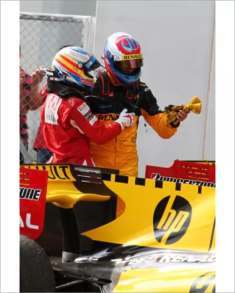 Formula One World Championship: Fernando Alonso Ferrari with Vitaly Petrov Renault in parc ferme