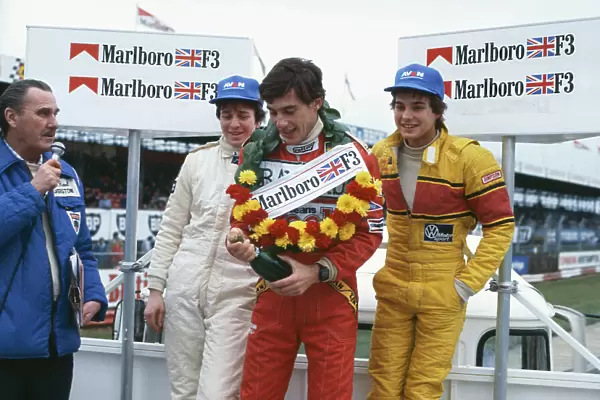 1983 British Formula 3 Championship. Silverstone, England. 6th March 1983. Ayrton Senna (Ralt RT3-Toyota), 1st position, with Martin Brundle (Ralt RT3-Toyota), 2nd position and Davy Jones (Ralt RT3-VW), 3rd position, on the podium, portrait