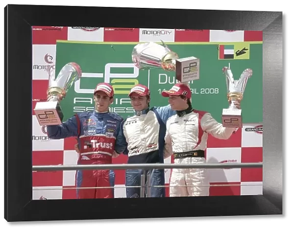 2008 GP2 Asia Series. Saturday Race. Dubai. Dubai Autodrome. 12th April. Marco Bonanomi (ITA, Piquet Sports) celebrates victory on the podium with Sebastien Buemi (SUI, Trust Team Arden) and Jerome D'Ambrosio (BEL, Dams)