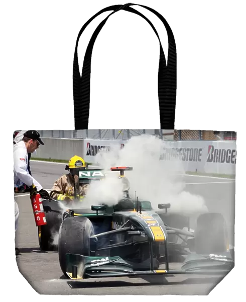 Formula One World Championship: Jarno Trulli Lotus T127 retires in the pitlane