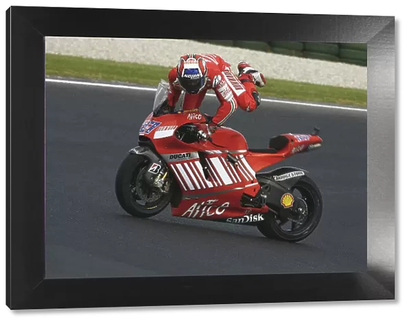 MotoGP. Casey Stoner (AUS), Marlboro Ducati Desmosedici, falls off his bike.