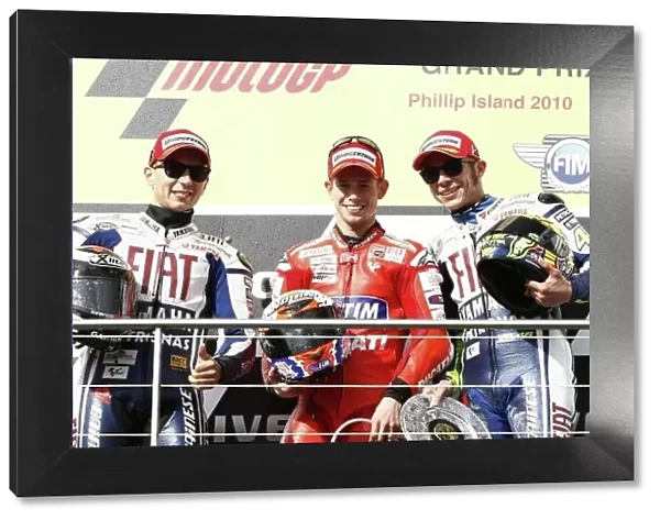MotoGP podium and results:. 1st Casey Stoner (AUS), Marlboro Ducati, centre.