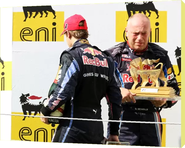 Formula One World Championship: Third placed Sebastian Vettel Red Bull Racing leaves the podium