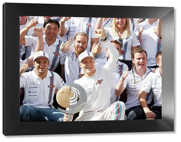 Red Bull Ring, Spielberg, Austria. Sunday 22 June 2014. Felipe Massa, Williams F1, and Valterri Bottas, Williams F1, celebrate with their team. World Copyright: Charles Coates / LAT Photographic. ref: Digital Image _N7T5120