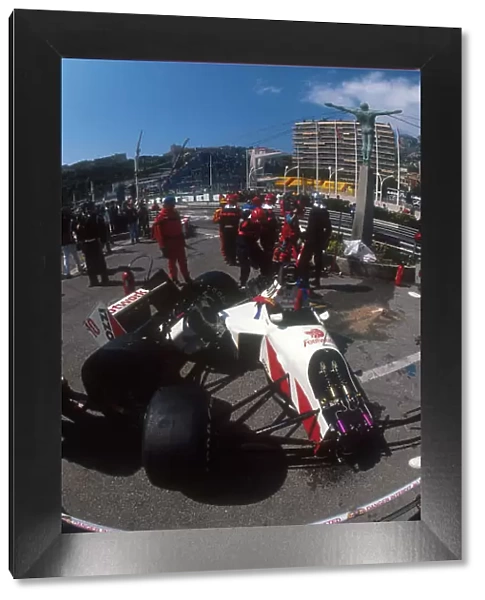 1991 Monaco Grand Prix. Monte Carlo, Monaco. 26-28 April 1991. Alex Caffi's destroyed Footwork FA12 Porsche behind the barriers at the Simming Pool Complex after his crash there during Saturday's free practice