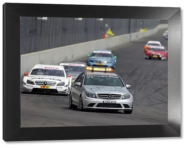 DTM. The Safety Car after the start crash leads Paul Di Resta 
