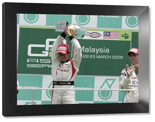 2008 GP2 Asia Series. Round 3. Sunday Race. Sepang, Kuala Lumpur. Malaysia. 23rd March. Kamui Kobayashi (JPN, Dams) celebrates his victory on the podium. World Copyright: Alastair Staley / GP2 Series Media Service ref:__MG_2107.jpg