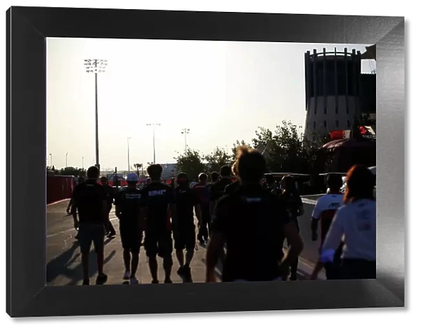 2014 GP2 Series Round 1 Bahrain International Circuit, Bahrain Saturday 5 April 2014. The GP2 drivers walk to the F1 Game Zone World Copyright: Sam Bloxham / LAT Photographic. ref: Digital Image _SBL6484